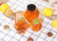 250ml-750ml 글라스 꿀은 LID로 삐걱거립니다, 육각형 글라스가 클리어 색상을 진동시킵니다